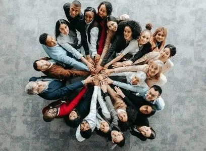 Group in circle holding hands